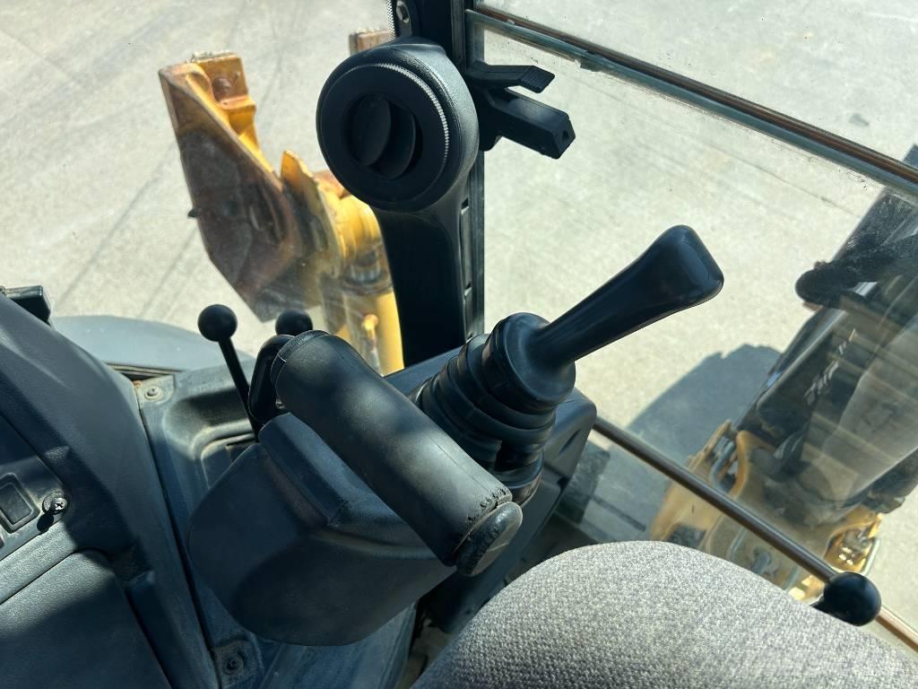 John Deere 310K Rovokopači