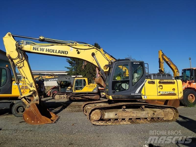 New Holland E 265 C Bageri guseničari