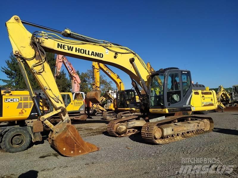 New Holland E 265 C Bageri guseničari