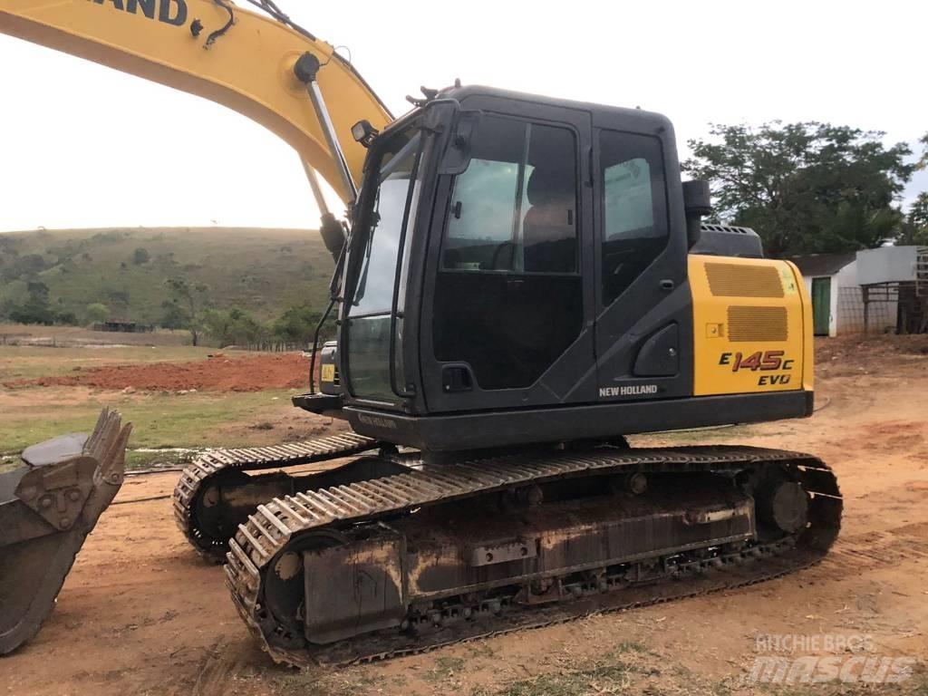 New Holland E 145 Bageri guseničari