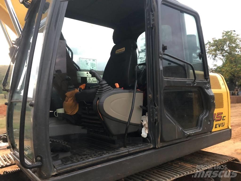 New Holland E 145 Bageri guseničari