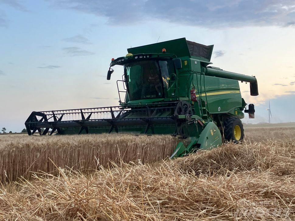 John Deere T 670 i Kombajni