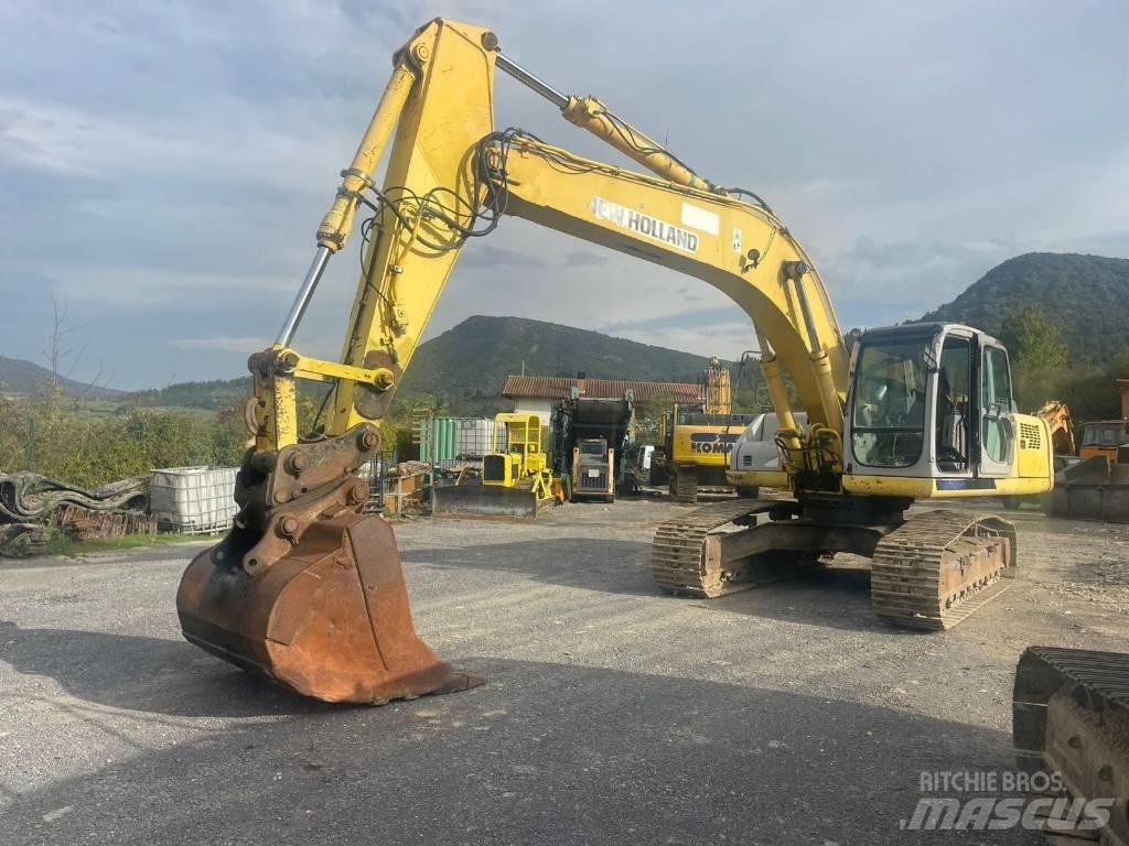 New Holland E 305 Bageri guseničari