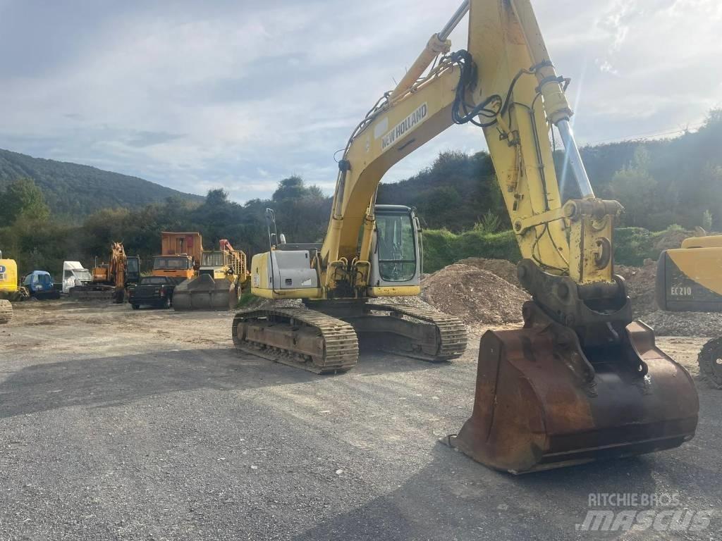 New Holland E 305 Bageri guseničari