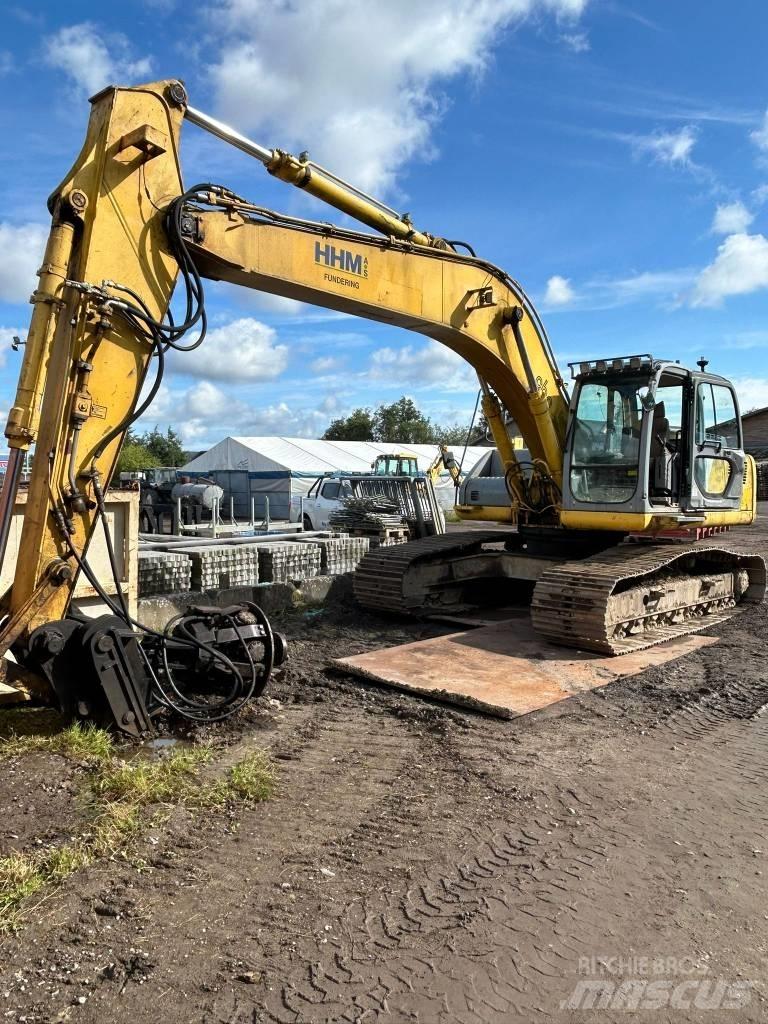 New Holland E 265 Bageri guseničari