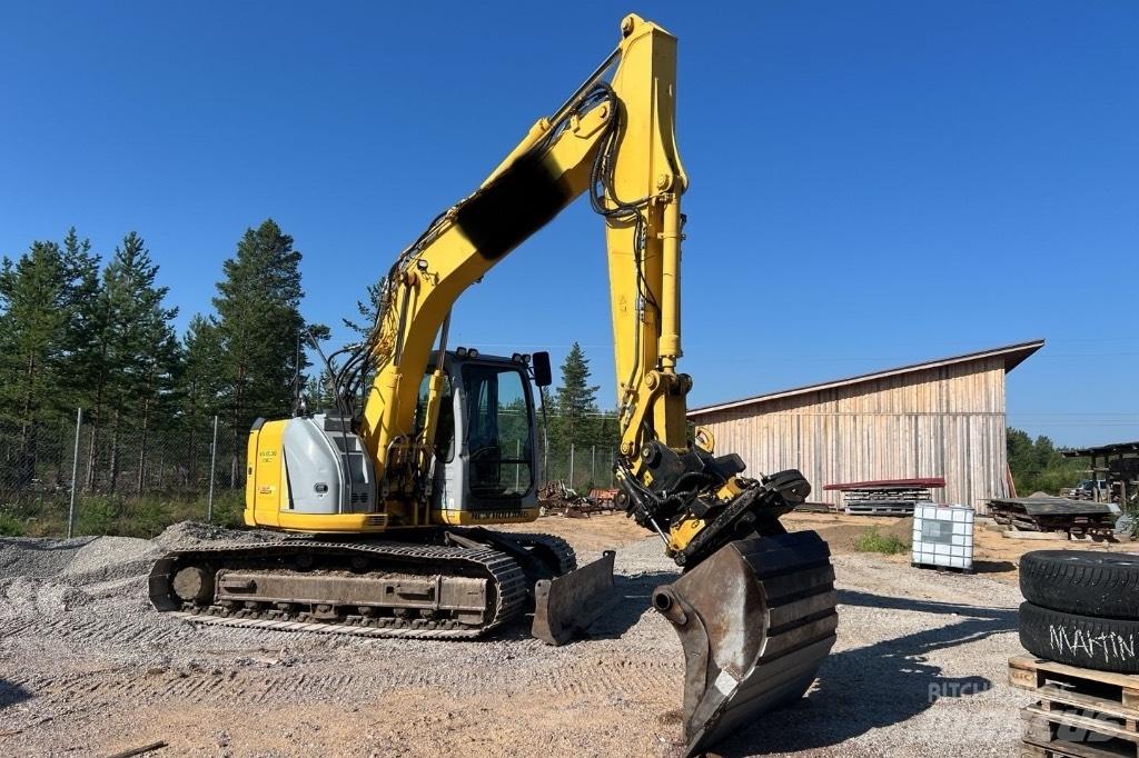 New Holland E 135 B Bageri guseničari