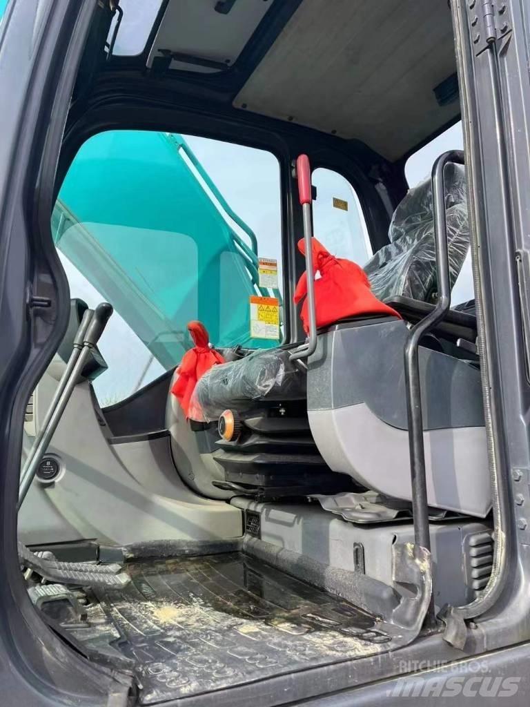 Kobelco SK210 Bageri guseničari
