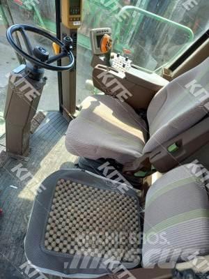John Deere C670 Kombajni