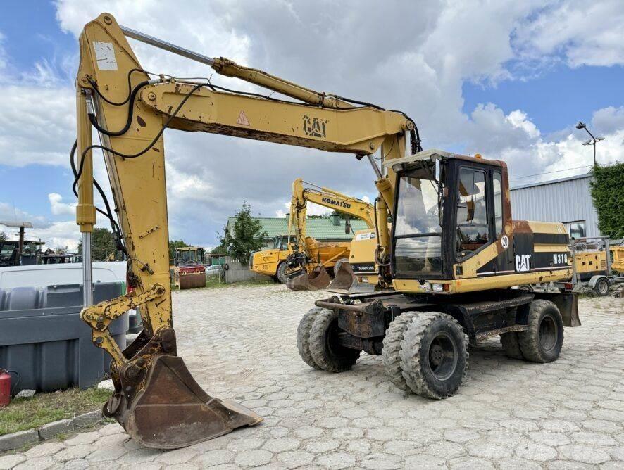 CAT M318 Bageri točkaši